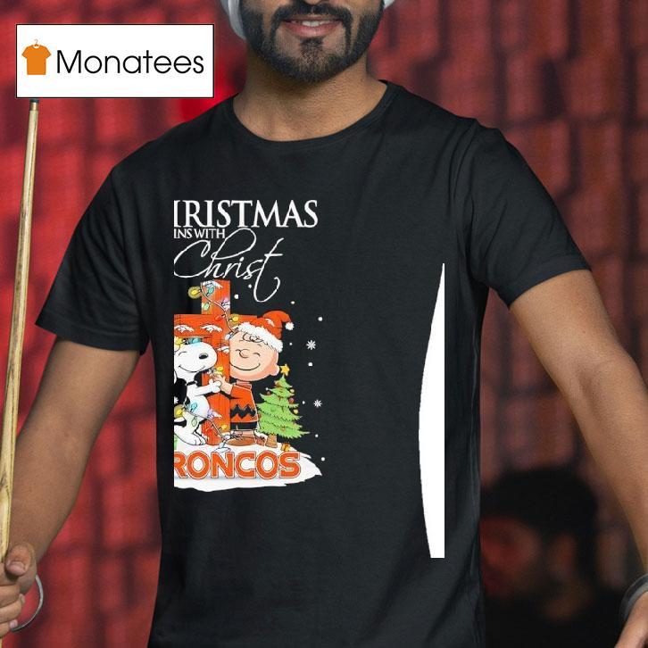 Denver Broncos Snoopy And Charlie Brown Holding Cross Christmas Begins With Chris T Shirt Denver Broncos Snoopy And Charlie Brown Holding Cross Christmas Begins With Chris T Shirt